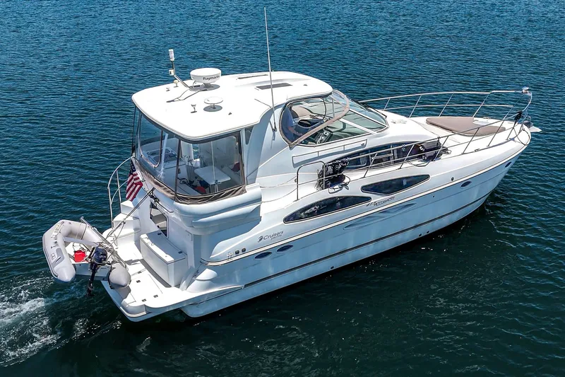 Slide: The Image of 2008 Cruisers Yachts 415 Express Motoryacht cruising on blue water. - 4