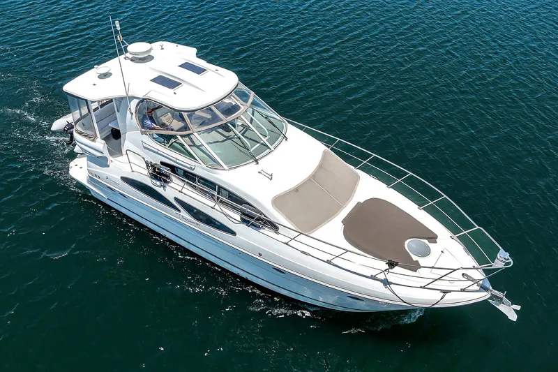 Slide: The Image of 2008 Cruisers Yachts 415 Express Motoryacht cruising on open water. - 8