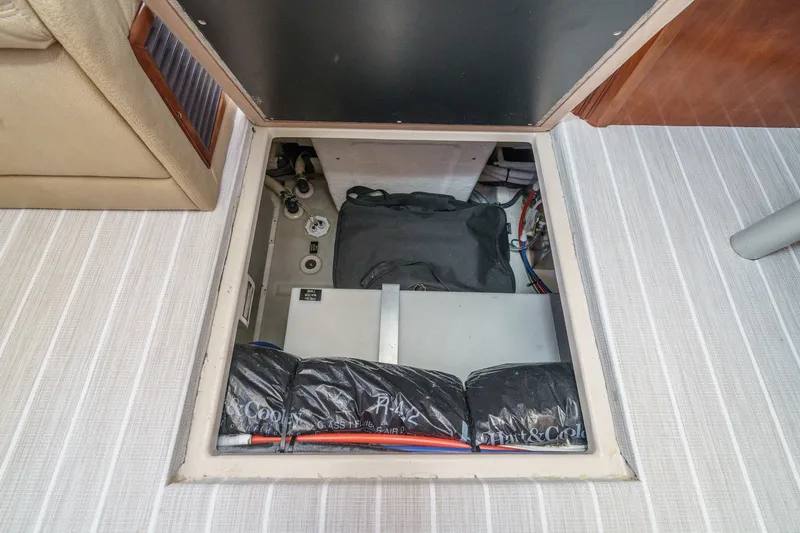 Slide: The Image of 2008 Cruisers Yachts 415 Express Motoryacht interior storage compartment with visible equipment. - 46