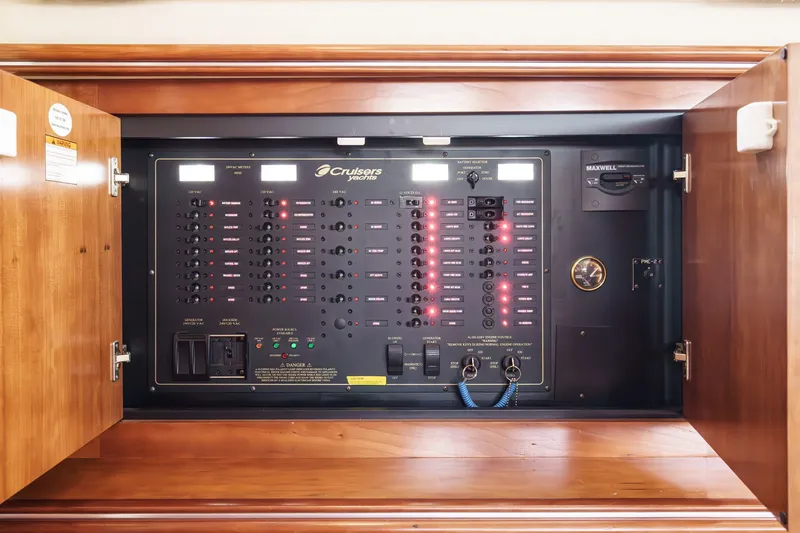 Slide: The Image of Electrical control panel of 2008 Cruisers Yachts 415 Express Motoryacht, featuring switches and indicators. - 44