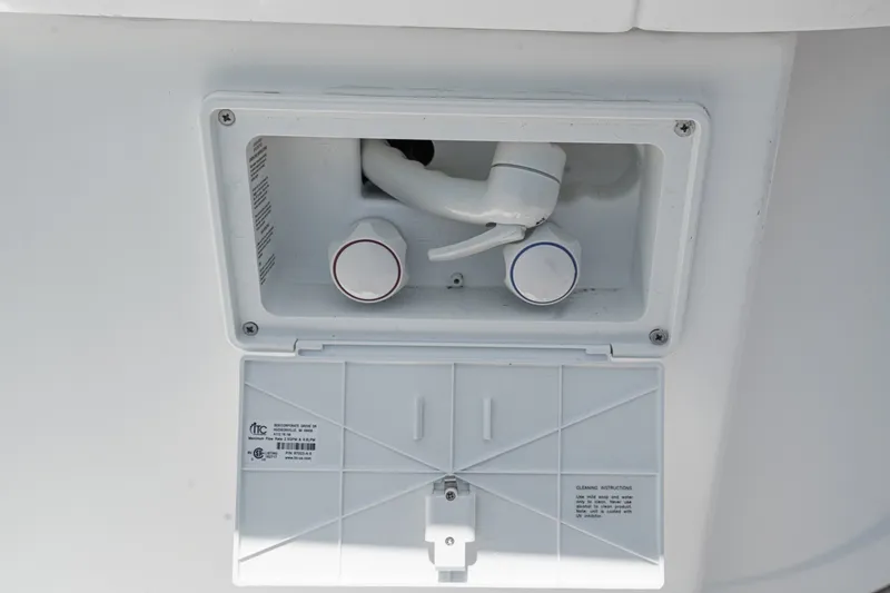 Slide: The Image of Water control panel on 2008 Cruisers Yachts 415 Express Motoryacht, featuring hot and cold knobs. - 19