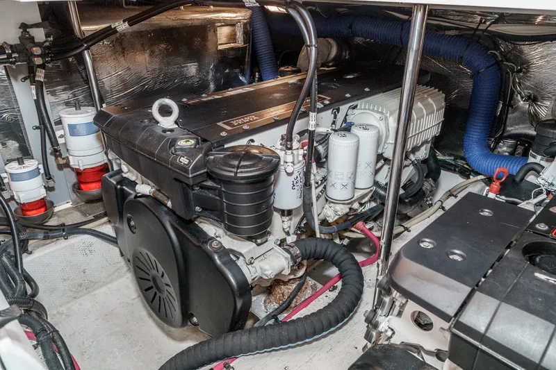 Slide: The Image of Engine room of 2008 Cruisers Yachts 415 Express Motoryacht, showcasing detailed mechanical components. - 64