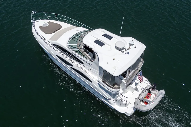 Slide: The Image of 2008 Cruisers Yachts 415 Express Motoryacht cruising on open water, aerial view. - 10