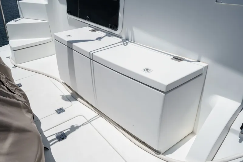 Slide: The Image of 2008 Cruisers Yachts 415 Express Motoryacht deck with storage compartments. - 16