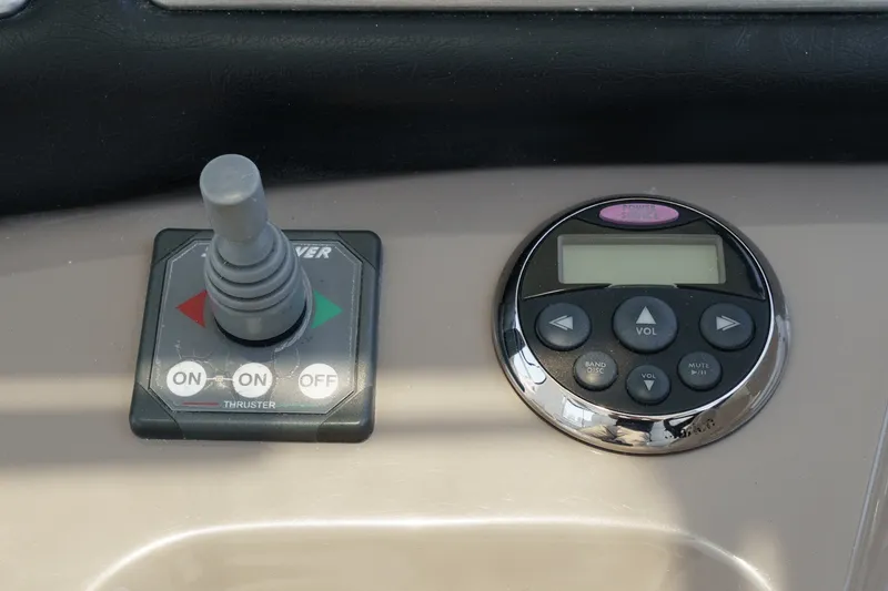 Slide: The Image of Control panel of 2008 Cruisers Yachts 415 Express Motoryacht with joystick and audio controls. - 32
