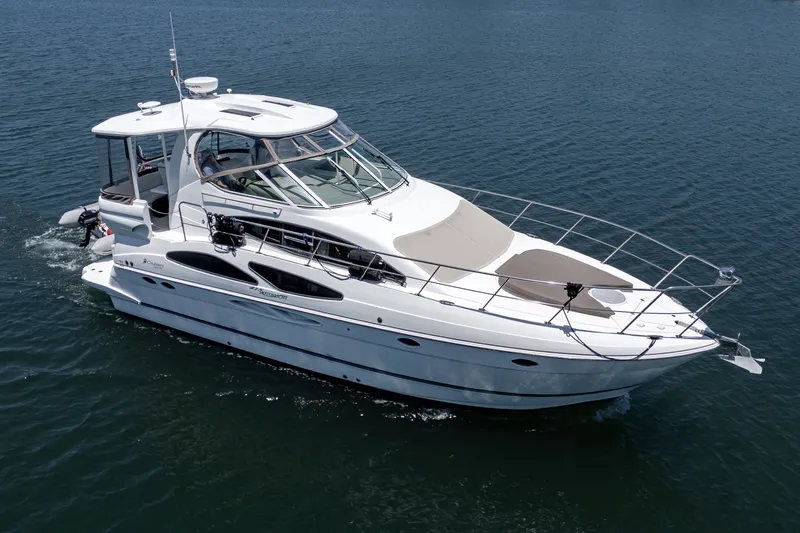 Slide: The Image of 2008 Cruisers Yachts 415 Express Motoryacht cruising on open water. - 12