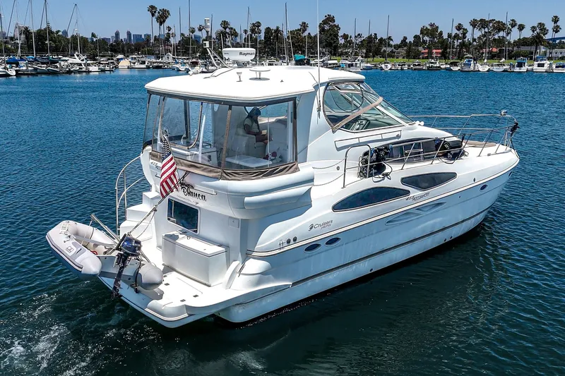 Slide: The Image of 2008 Cruisers Yachts 415 Express Motoryacht on serene marina waters, showcasing sleek design. - 5