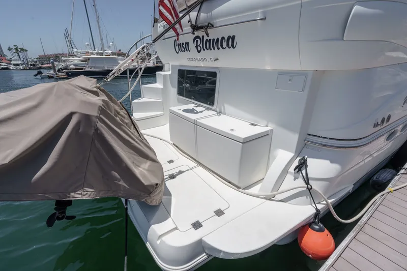 Slide: The Image of 2008 Cruisers Yachts 415 Express Motoryacht docked, featuring rear deck and covered equipment. - 14