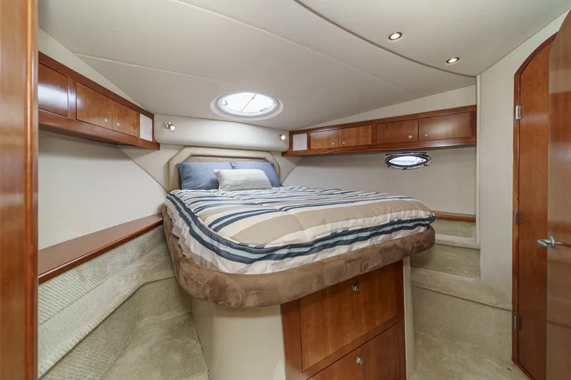 Slide: The Image of Luxurious bedroom interior of 2008 Cruisers Yachts 415 Express Motoryacht with wood cabinetry. - 50