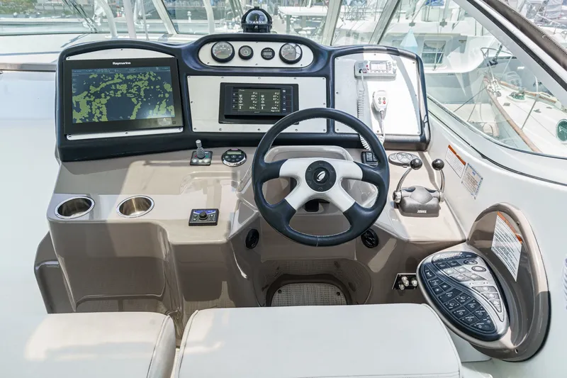 Slide: The Image of 2008 Cruisers Yachts 415 Express Motoryacht helm with navigation equipment and controls. - 28