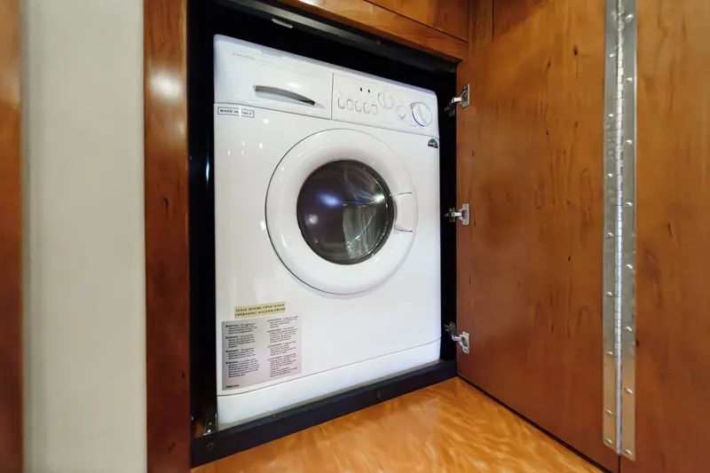 Slide: The Image of Washing machine inside 2008 Cruisers Yachts 415 Express Motoryacht wooden cabinet. - 58