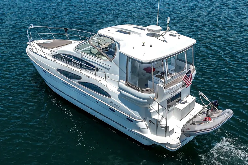 Slide: The Image of 2008 Cruisers Yachts 415 Express Motoryacht on open water, showcasing sleek design and luxury. - 11