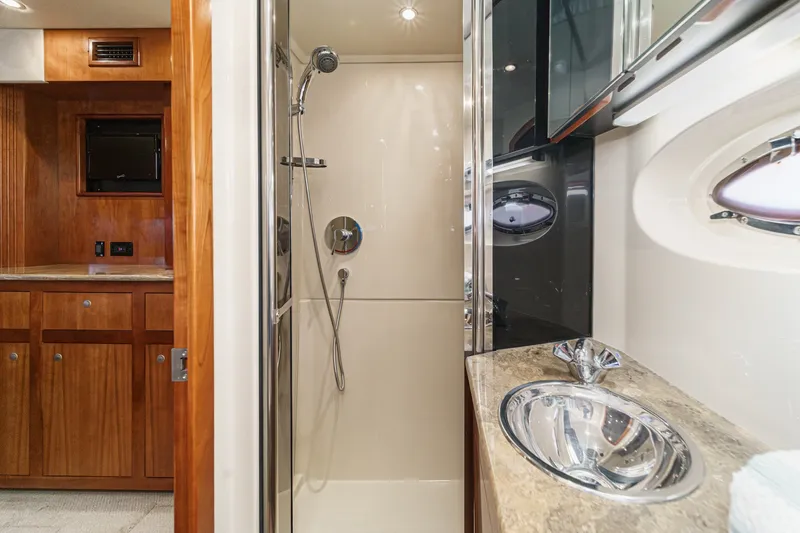Slide: The Image of Luxurious bathroom in 2008 Cruisers Yachts 415 Express Motoryacht with shower and sink. - 60