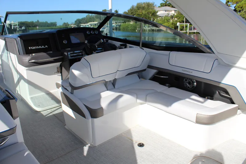 Slide: The Image of 2023 Formula 330 Crossover Bowrider interior with luxurious seating and modern dashboard. - 28
