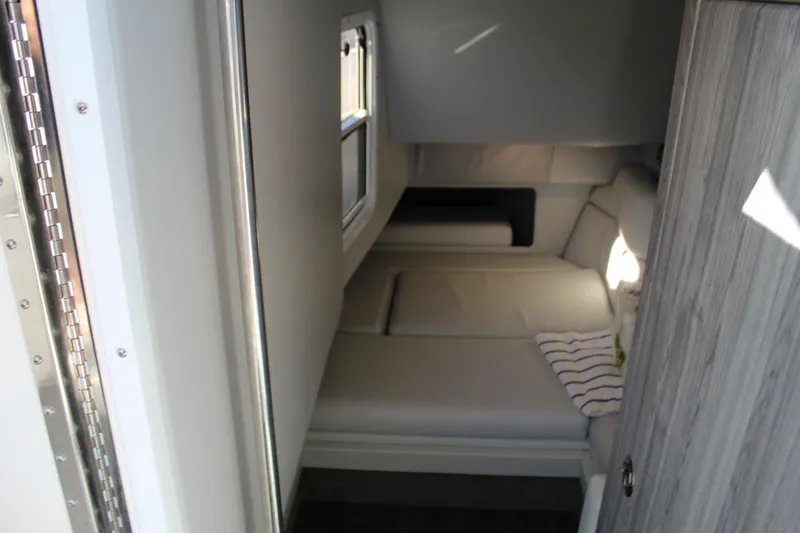 Slide: The Image of 2023 Formula 330 Crossover Bowrider cabin interior with cozy seating and modern design. - 35