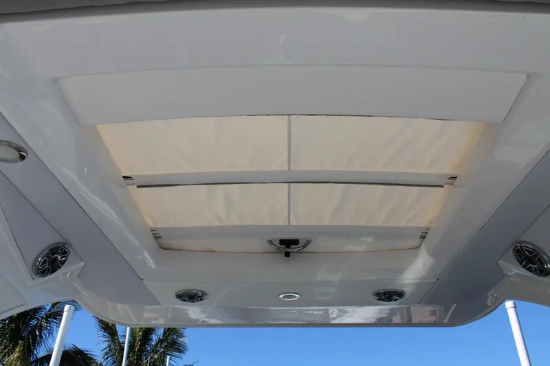 Slide: The Image of 2023 Formula 330 Crossover Bowrider sunroof with integrated speakers and sleek design. - 31