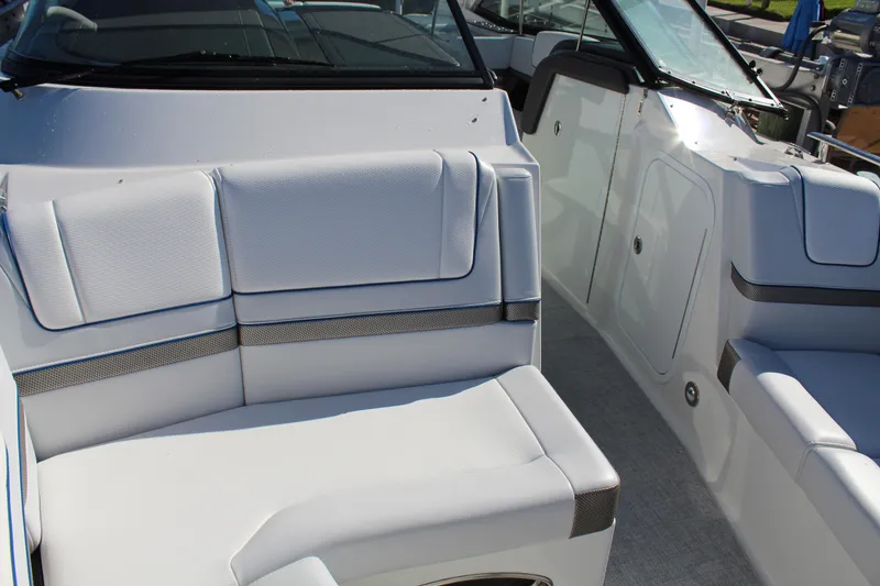 Slide: The Image of 2023 Formula 330 Crossover Bowrider interior with white seating and sleek design. - 19