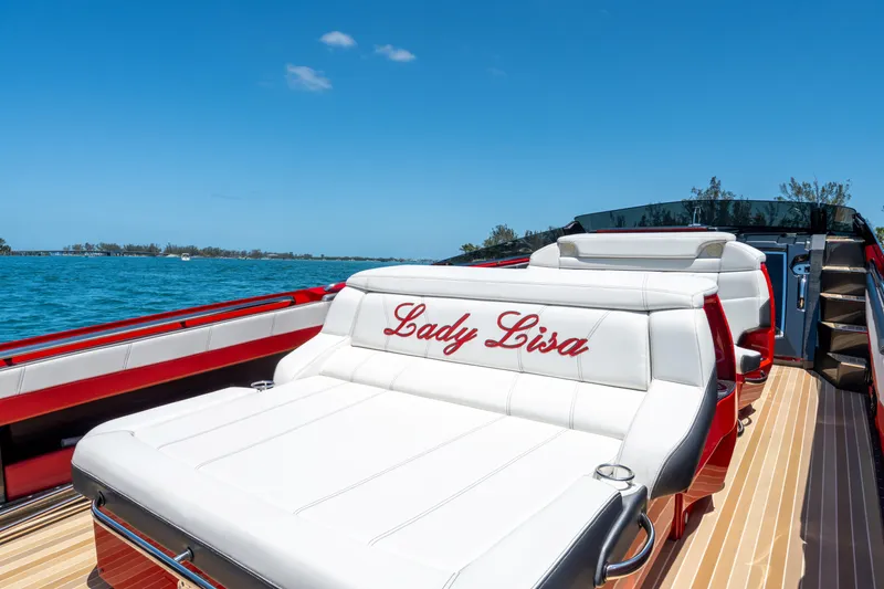 Slide: The Image of 2023 Nor-Tech 55 Flyer luxury boat with "Lady Lisa" embroidered seating, cruising on a sunny day. - 35