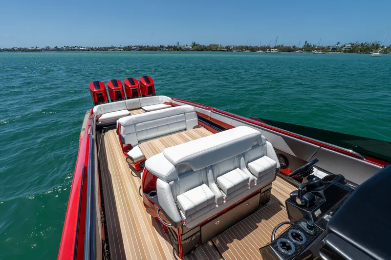 Slide: The Image of 2023 Nor-Tech 55 Flyer boat with luxurious seating on open water. - 31