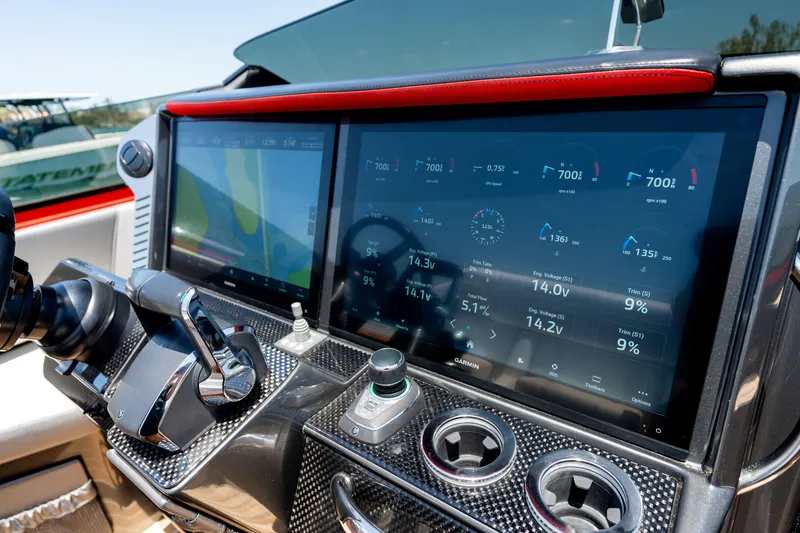 Slide: The Image of Dashboard of 2023 Nor-Tech 55 Flyer with advanced navigation and control systems. - 43