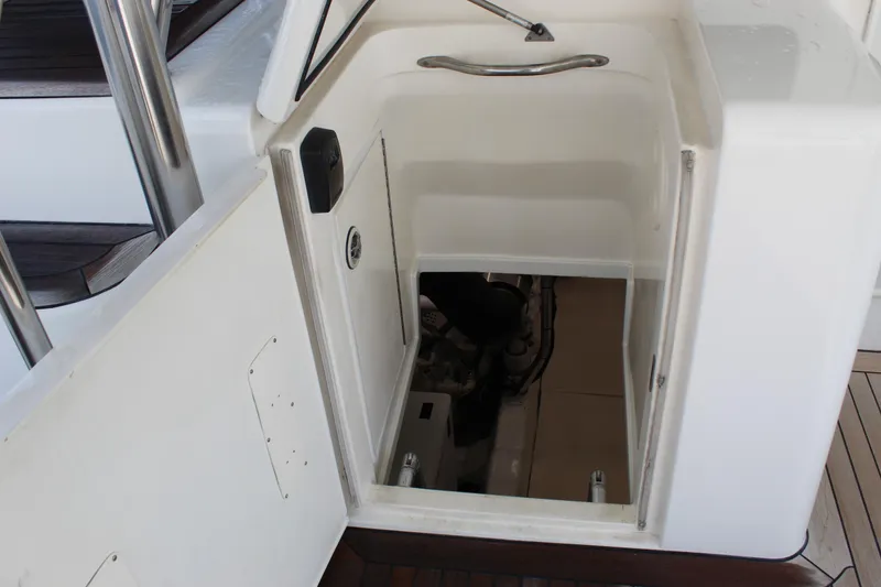 Slide: The Image of Engine compartment access on 2003 Ocean Yachts 65 Odyssey boat. - 96