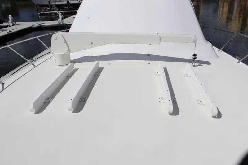 Slide: The Image of 2003 Ocean Yachts 65 Odyssey deck with davit and railings. - 23