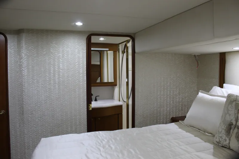 Slide: The Image of Luxurious bedroom and bathroom in 2003 Ocean Yachts 65 Odyssey yacht. - 73