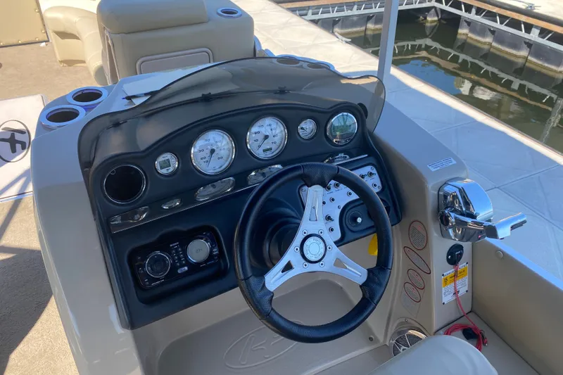 Slide: The Image of 2012 Harris FloteBote Grand Mariner SL 250 dashboard with steering wheel and gauges. - 20