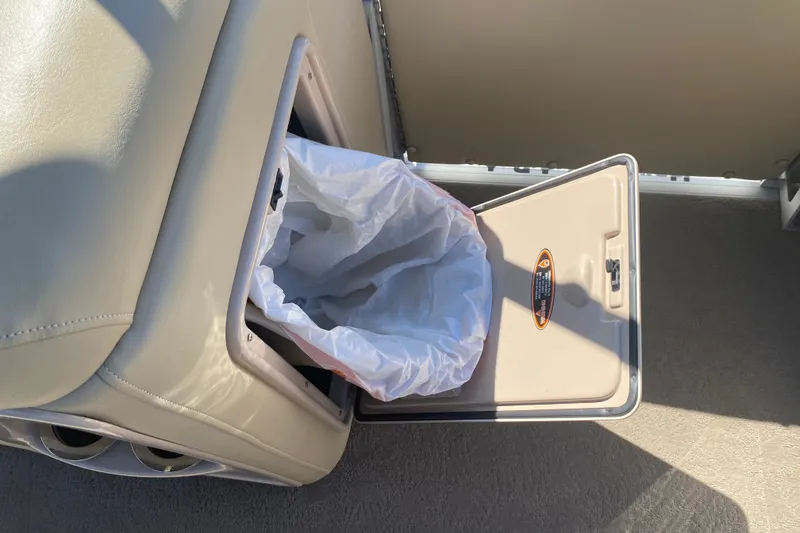 Slide: The Image of Built-in trash compartment on 2012 Harris FloteBote Grand Mariner SL 250 boat. - 25