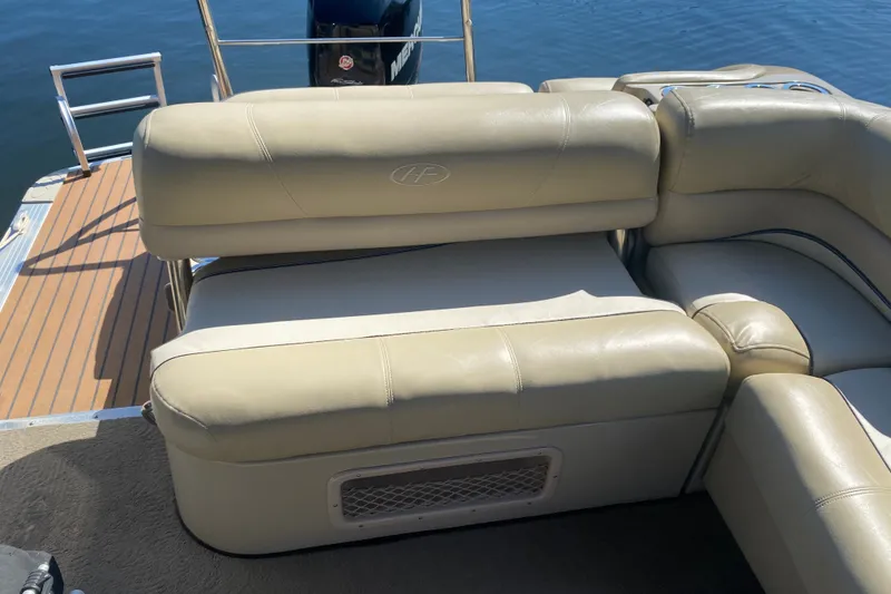 Slide: The Image of 2012 Harris FloteBote Grand Mariner SL 250 with beige seating and wooden deck. - 16