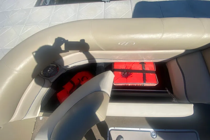 Slide: The Image of Interior of 2012 Harris FloteBote Grand Mariner SL 250 with life jackets stored under seat. - 31