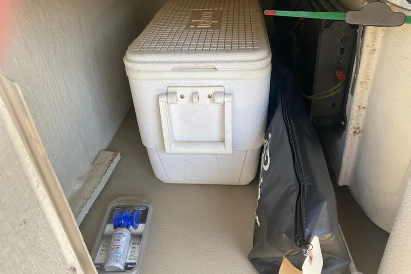 Slide: The Image of Storage compartment of 2012 Harris FloteBote Grand Mariner SL 250 with cooler and accessories. - 26