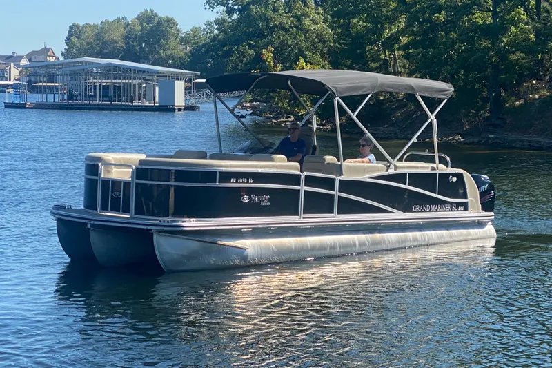 The Image of 2012 Harris FloteBote Grand Mariner SL 250 pontoon boat on a serene lake. - 1