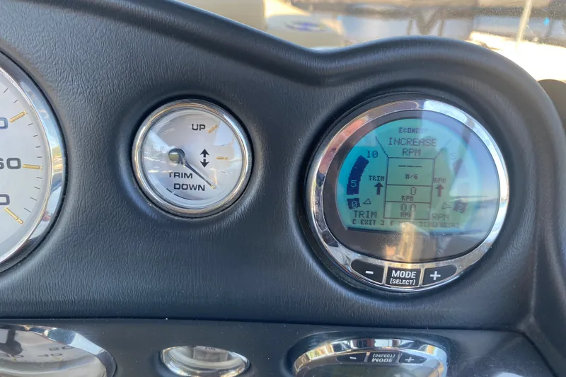 Slide: The Image of Dashboard of 2012 Harris FloteBote Grand Mariner SL 250 with trim and RPM gauges. - 23