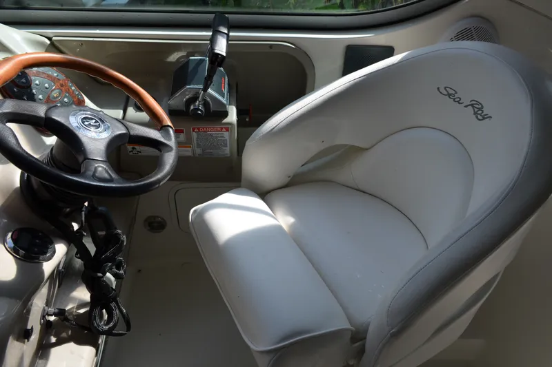 Slide: The Image of Interior of 2007 Sea Ray Sundancer 280 boat, featuring steering wheel and captain's seat. - 25