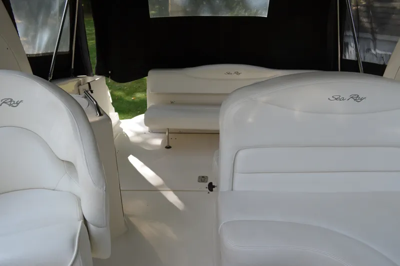 Slide: The Image of Interior of 2007 Sea Ray Sundancer 280 with white seating and black curtains. - 33
