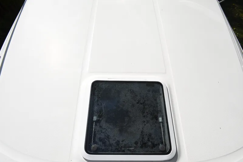 Slide: The Image of 2007 Sea Ray Sundancer 280 boat hatch on white deck surface. - 10
