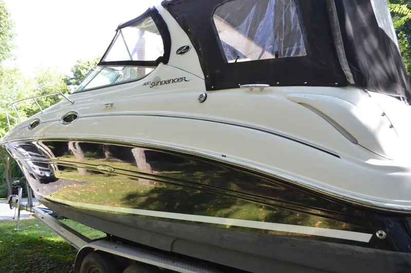 Slide: The Image of 2007 Sea Ray Sundancer 280 boat on trailer, side view with black canopy. - 4