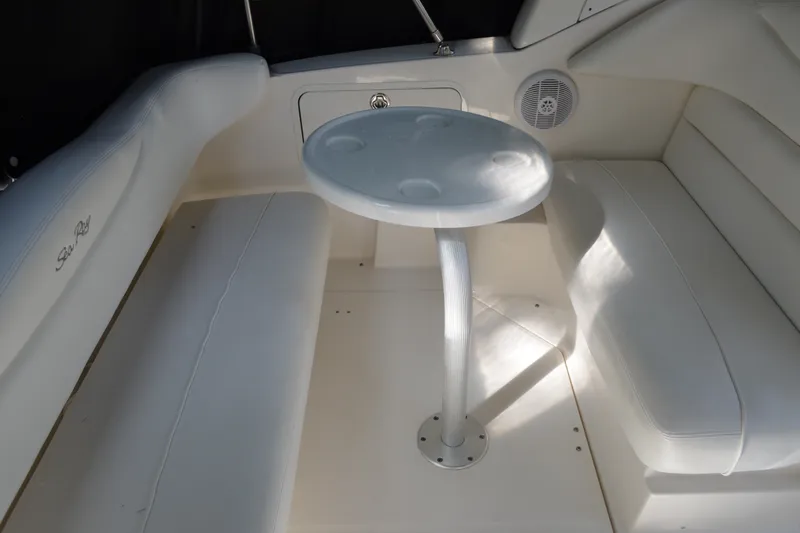 Slide: The Image of 2007 Sea Ray Sundancer 280 interior with white seating and round table. - 14