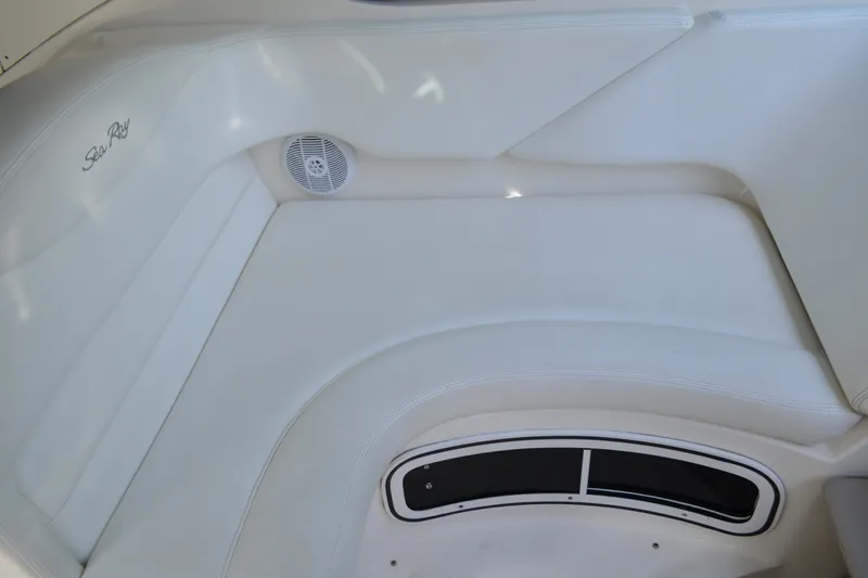 Slide: The Image of Interior seating of 2007 Sea Ray Sundancer 280 boat, featuring white upholstery and speaker. - 32