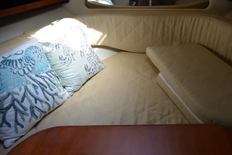 Slide: The Image of Interior cabin of 2007 Sea Ray Sundancer 280 with decorative pillows. - 42