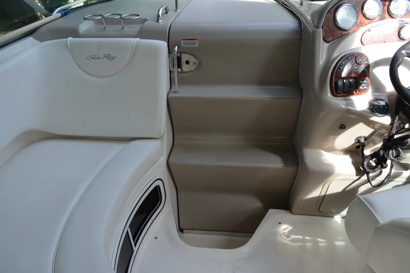 Slide: The Image of 2007 Sea Ray Sundancer 280 cockpit with steering wheel and seating area. - 31