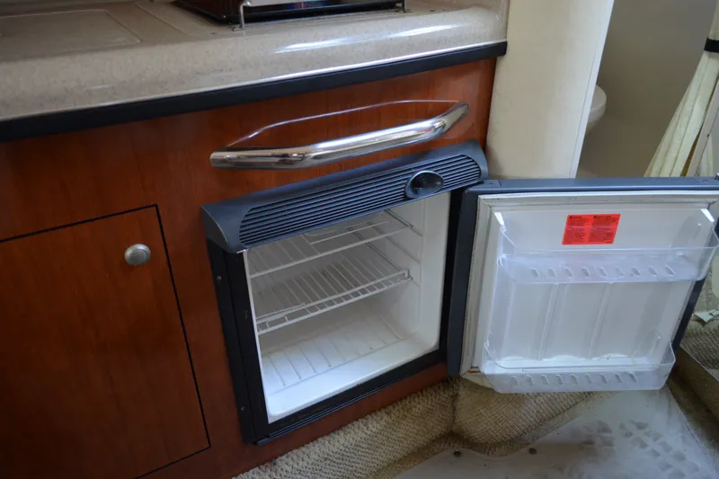 Slide: The Image of Open mini fridge in 2007 Sea Ray Sundancer 280 boat interior. - 46