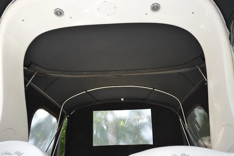 Slide: The Image of 2007 Sea Ray Sundancer 280 boat interior canopy with sleek design and window view. - 34