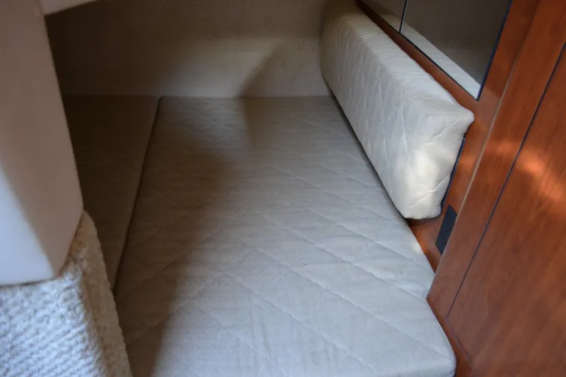 Slide: The Image of Interior cabin of 2007 Sea Ray Sundancer 280 with cushioned seating. - 55