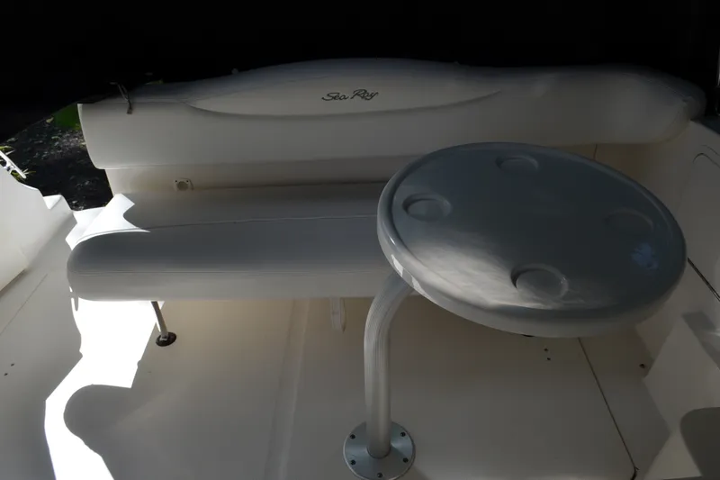 Slide: The Image of Interior seating area of a 2007 Sea Ray Sundancer 280 boat with a round table. - 18