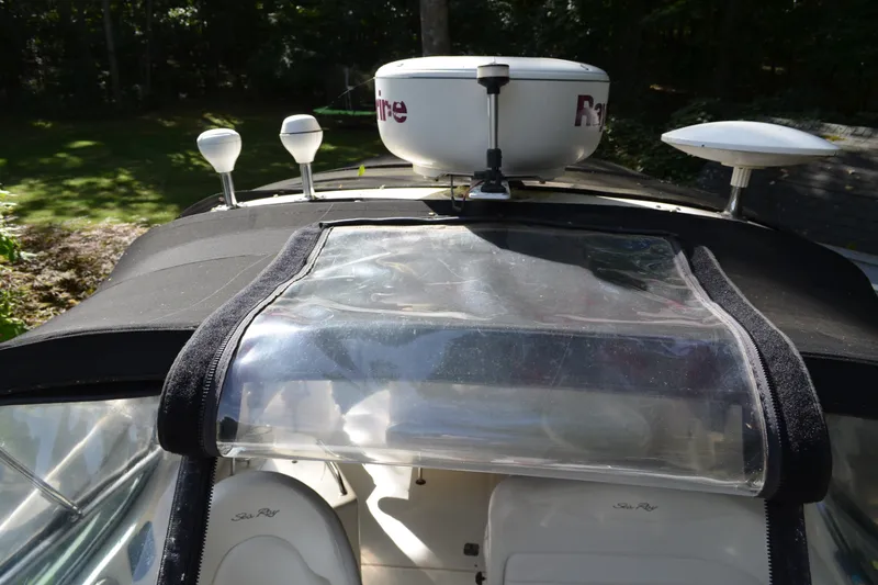 Slide: The Image of 2007 Sea Ray Sundancer 280 boat with radar and clear canopy cover. - 12