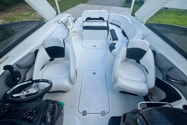 Slide: The Image of 2017 Monterey 264FS boat interior with white seating and steering wheel. - 14