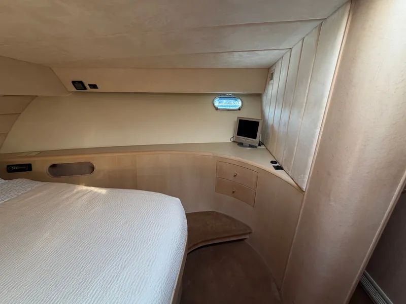 Slide: The Image of The 1990 Heisley Marine Custom 70 cabin features elegant, minimalist design with a small window. - 33
