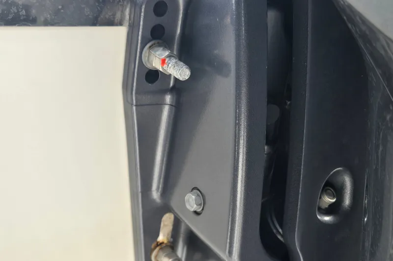 Slide: The Image of Close-up of 2023 Cobalt 30SC Outboard engine components and mounting details. - 24